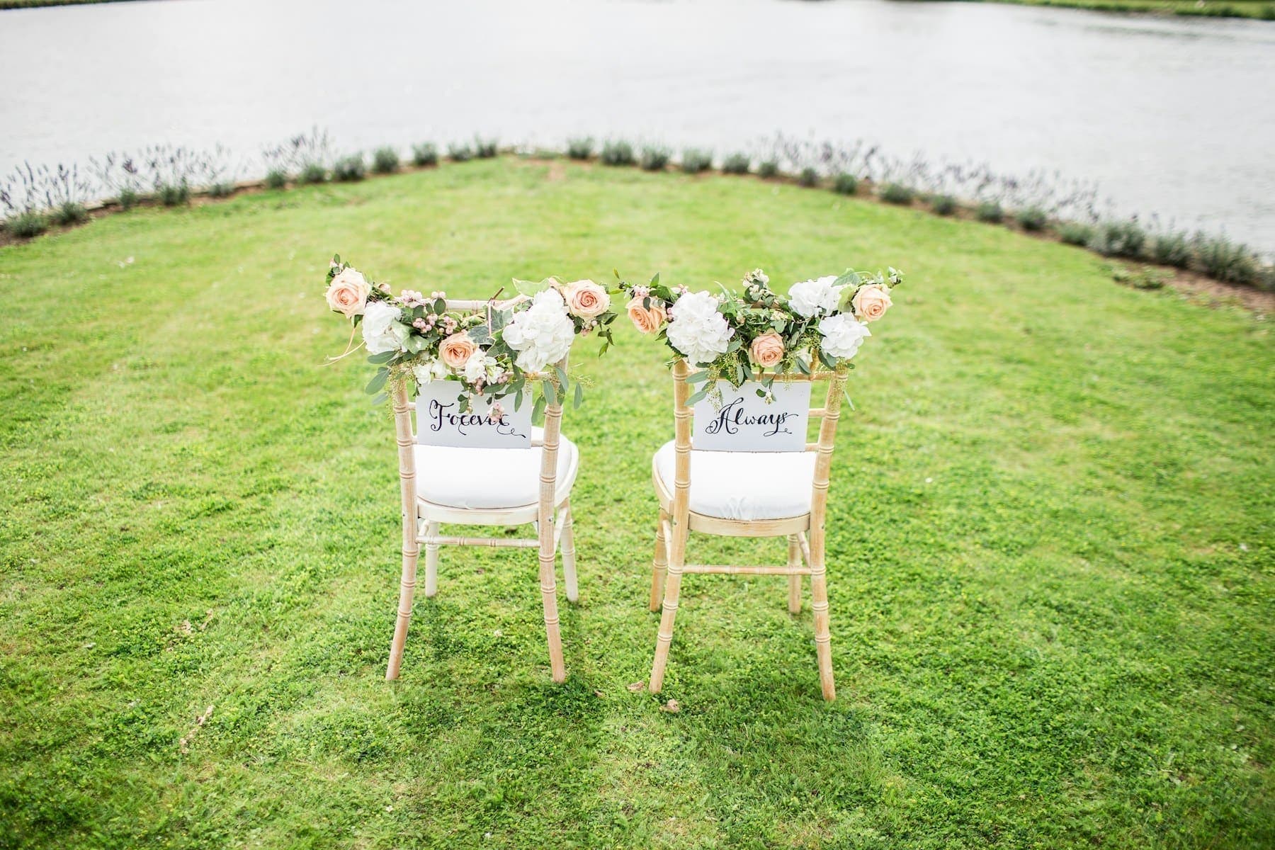 Chairs decorated with flowers for an outdoor engagement
